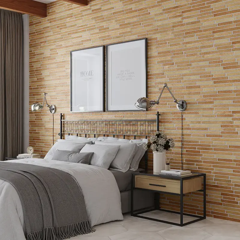 Imagem de azulejo rústico para parede criando parede de destaque atrás da cama.